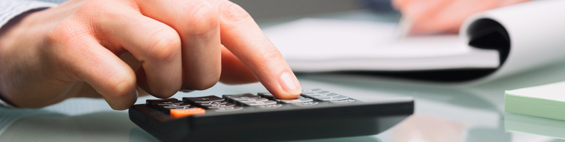 young male using calculator