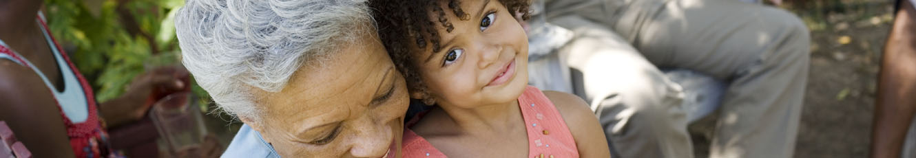 photo of a little girl and a lady beside each other smiling 
