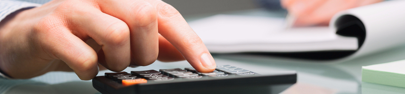 young male using calculator